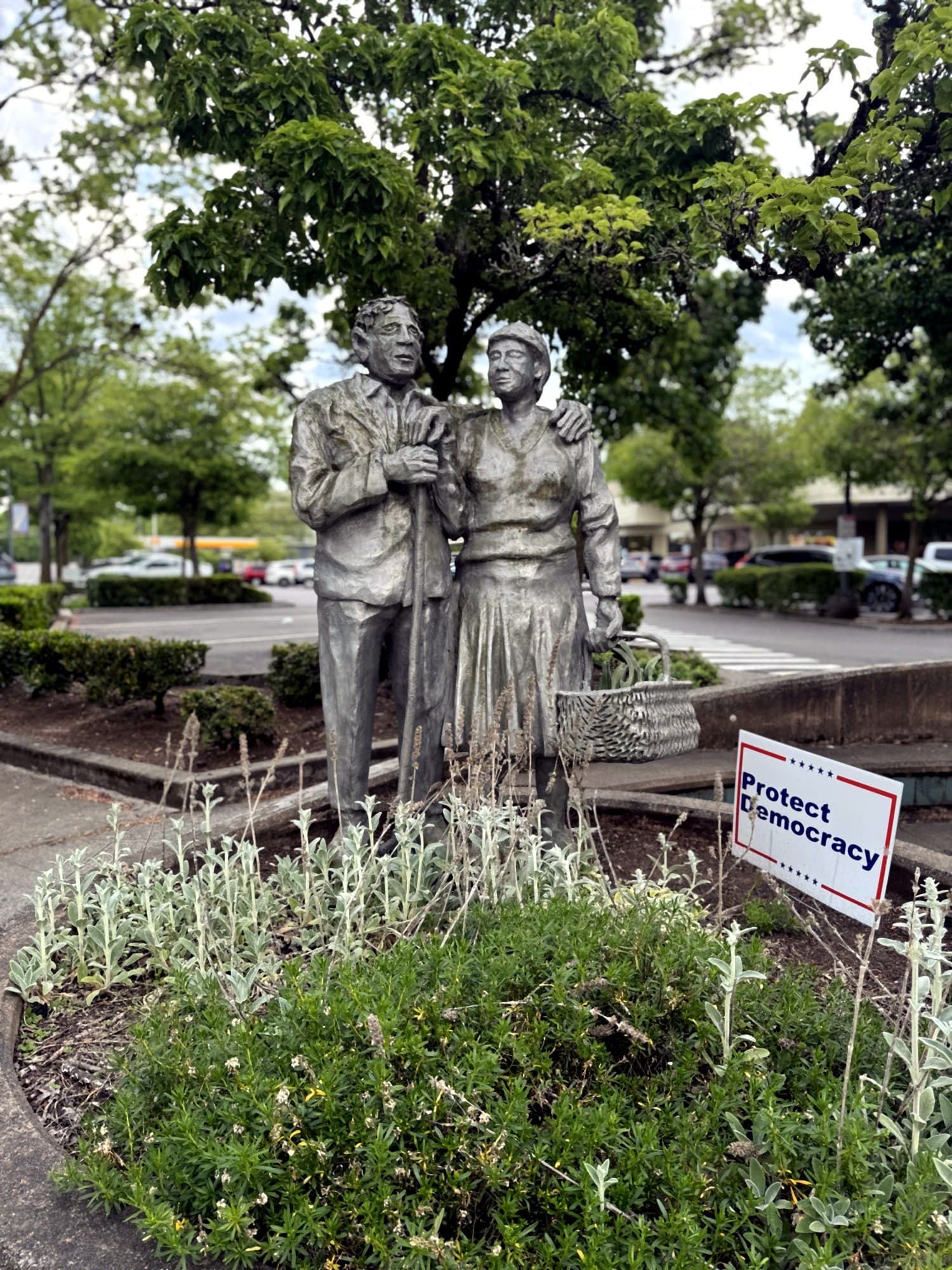 The Lovers sculpture in front of the 128 building